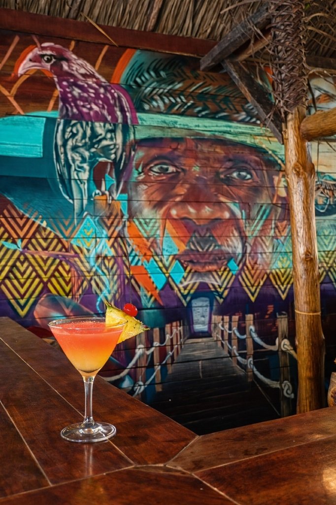 Indigenous portrait mural in bar — ArteUnoK